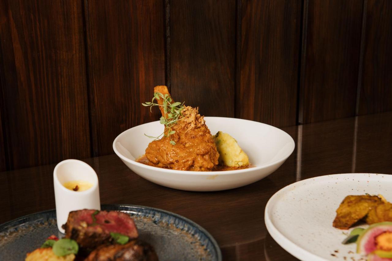 The Lalit London Hotel Exterior photo A plate of chicken 65