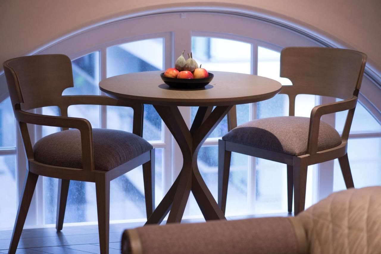 The Lalit London Hotel Room photo A table and two chairs